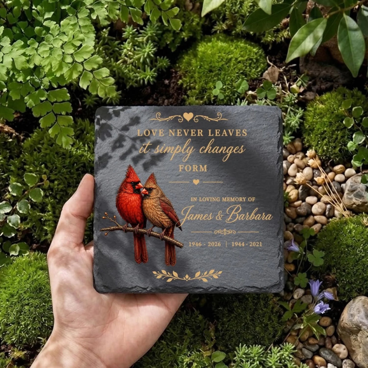 Square cardinal memorial stone held in hand