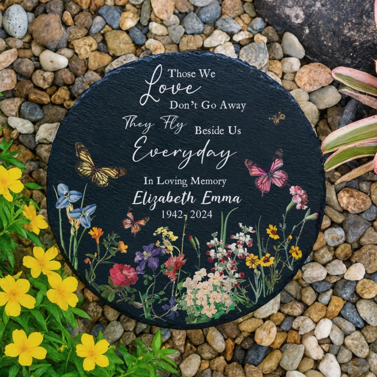 Memorial garden stone among pebbles