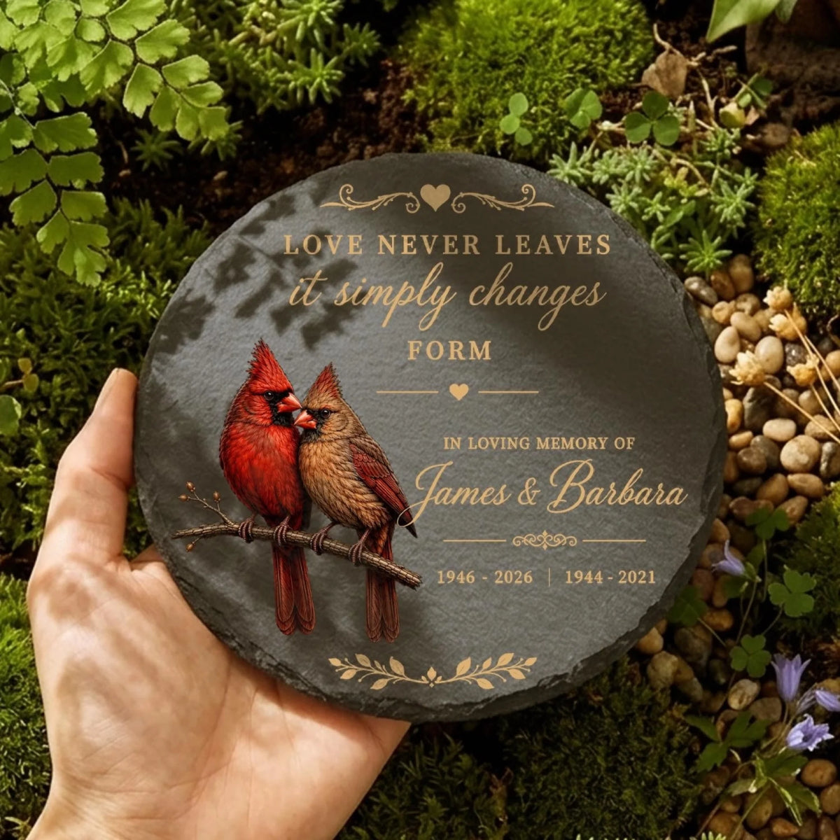 Round cardinal memorial stone held in hand