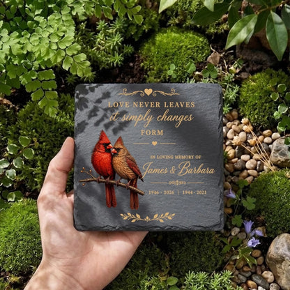 Square cardinal memorial stone held in hand