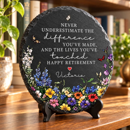 Happy Retirement slate on easel stand by bookshelf